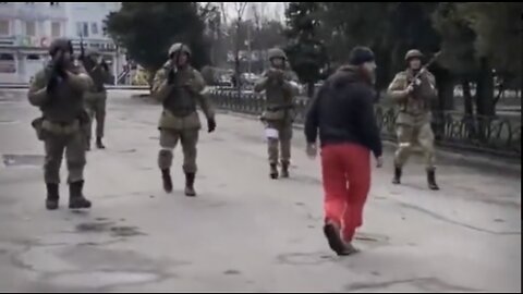 Ukrainians March Toward Russian Soldiers While Getting Shot At