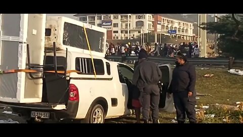 SA Riots ( bakkie full of stolen goods , driver is arrested )