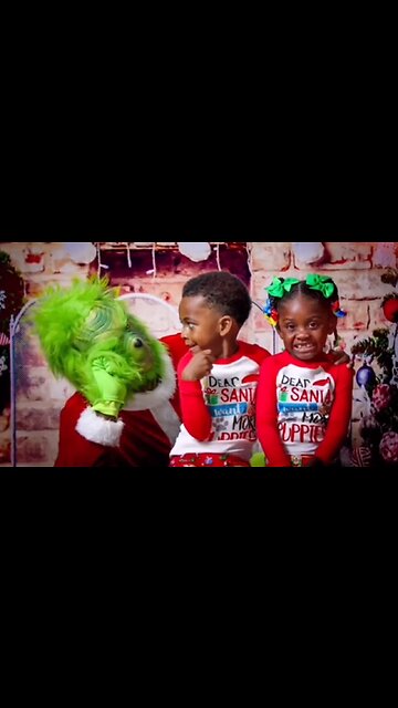 The Grinch scares kids during Christmas photoshoot