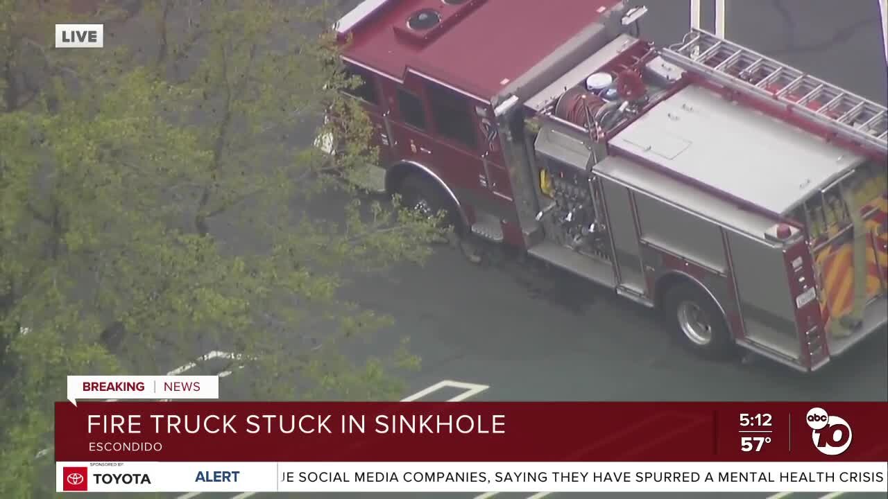 Emergency crews respond to Escondido Fire engine stuck in sinkhole