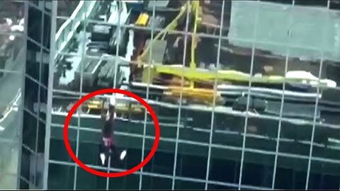 Video shows worker dangling from crane at Toronto construction site