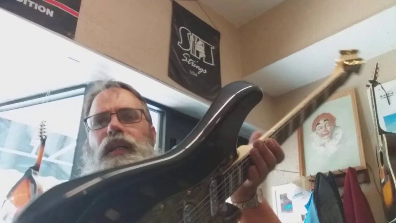 Metallic black/red Strat style guitar