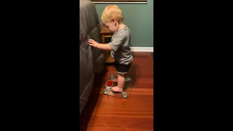 Baby Weighs Himself on Scale - Cuteness Overload