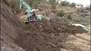 Yanmar YB451 Excavator Repairing The Lower End Of The Switchback Trail