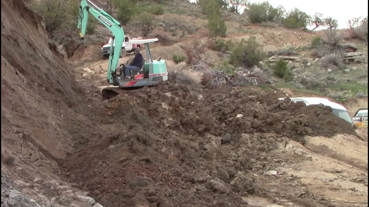 Yanmar YB451 Excavator Repairing The Lower End Of The Switchback Trail