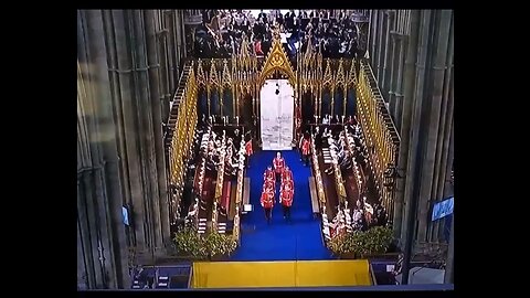 Weird figure crosses the doorway at the kings coronation