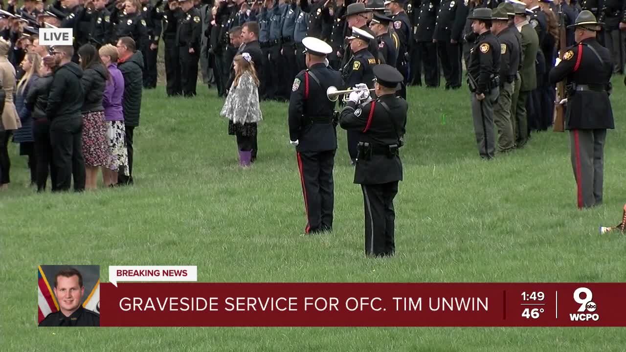 Fallen police officer Tim Unwin laid to rest with Taps, 21-gun salute