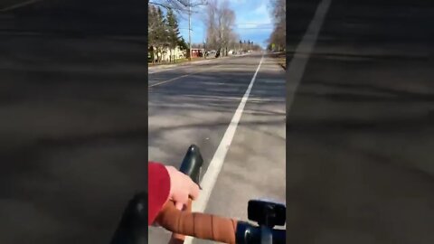 First person biking through town