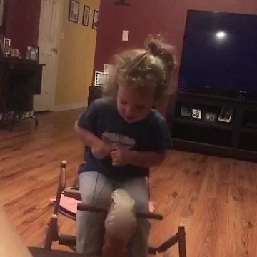 Toddler Girl Falls Down Off A Rocking Horse