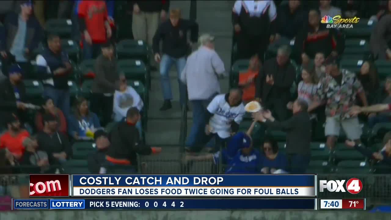 Fan drops food TWICE to catch foul balls at baseball game