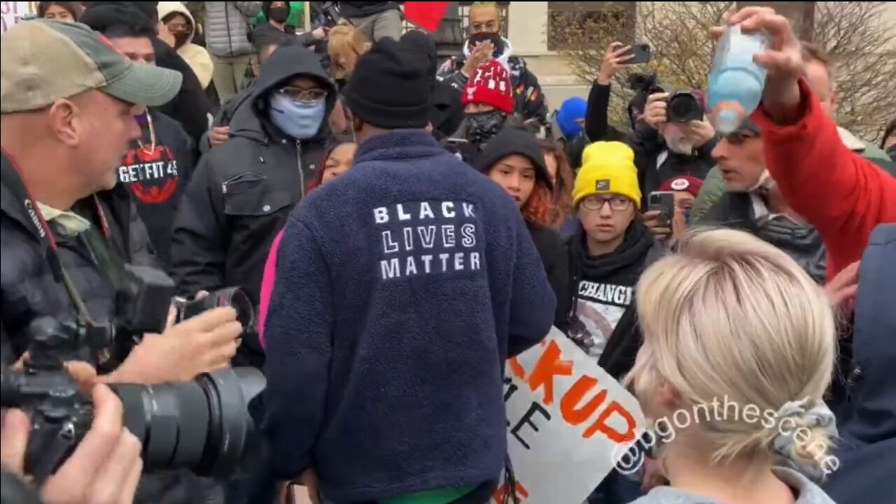 Anti Rittenhouse Protestor Pours Liquid on Someone