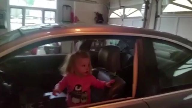 "Toddler Girl Absolutely Amazed by Garage Door Closing"