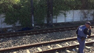 SOUTH AFRICA - Cape Town - The corpse of a young male lay alongside the train track in Southfield. (Video) (jHA)