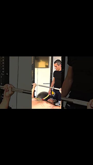 Andrew Tate doing bench press