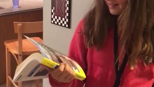 Pile Of Yellow Pages Leaves Clueless Teenage Girl Utterly Confused