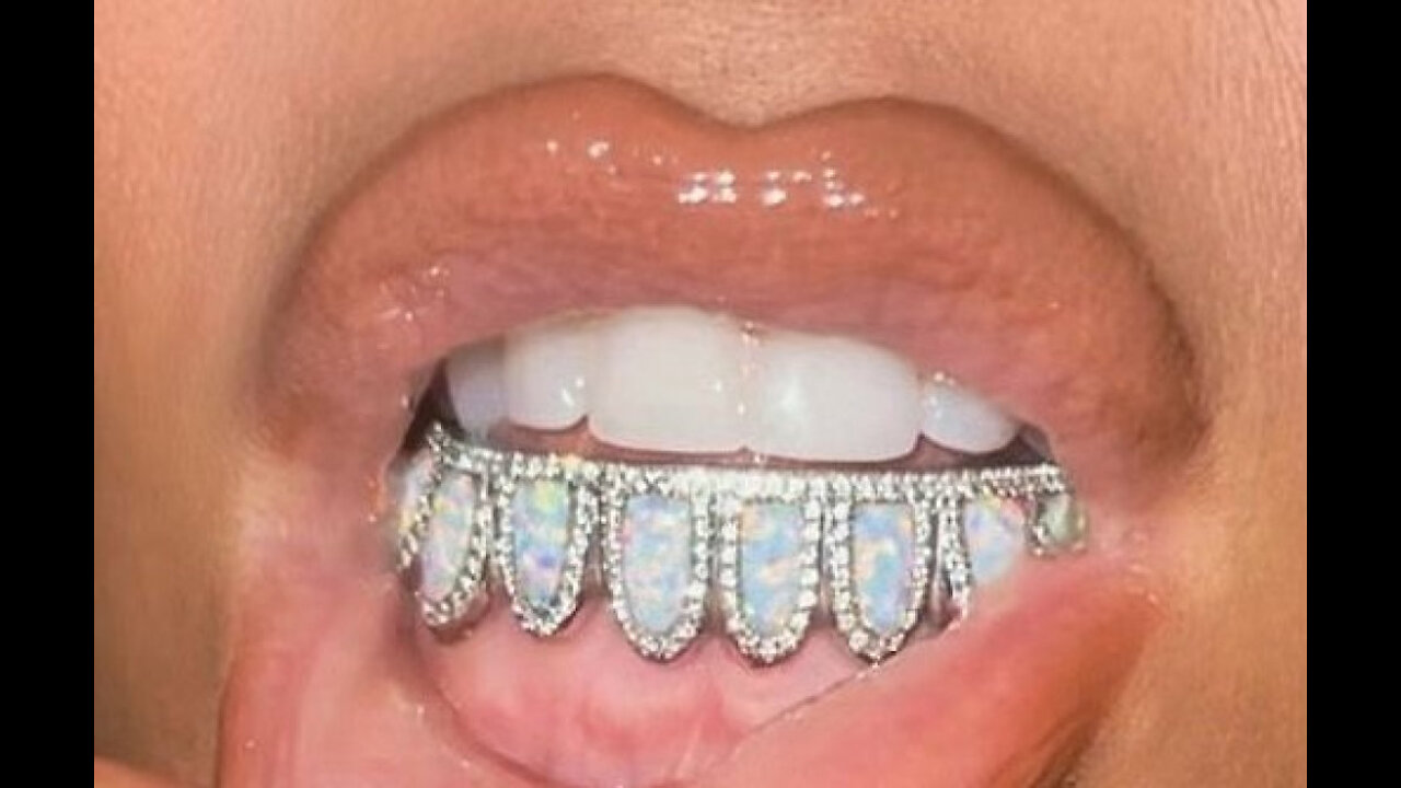 Kim Kardashian West shows off dazzling diamond and opal birthstone grill