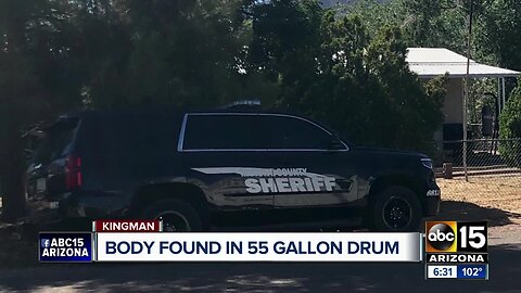 Two arrested after body found in 55-gallon drum buried in Kingman backyard