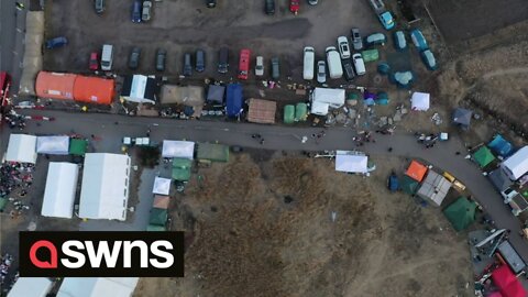 Drone shots show bleakness and desperation at the Polish border with Ukraine