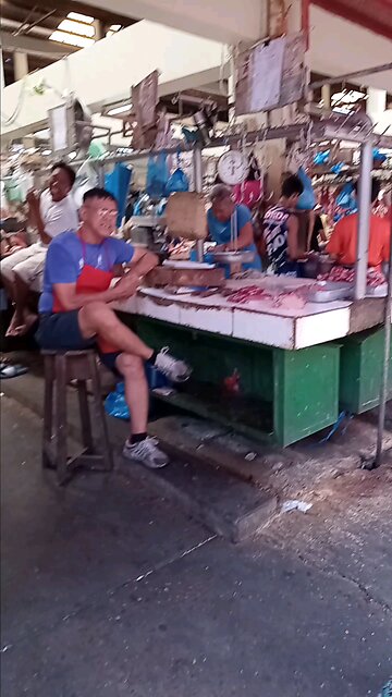 Filipinos Working and Shopping in the City Market