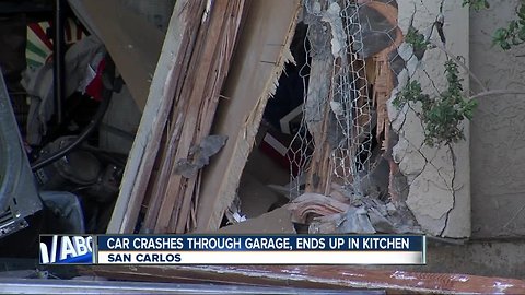 Car slams into garage, ends up in kitchen