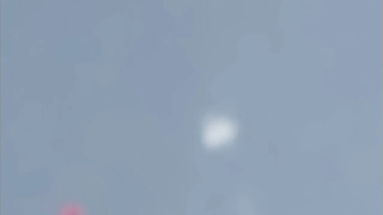 very fast high altitude sphere UFO over clouds