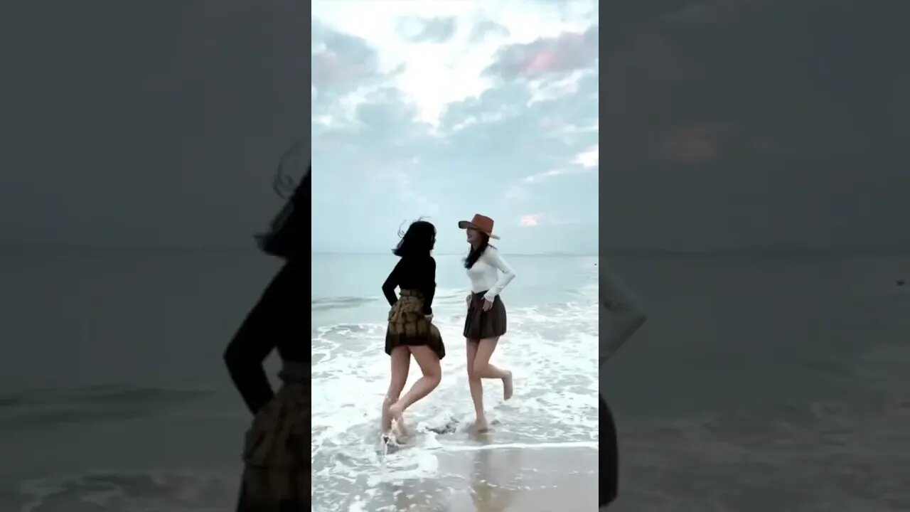Two Cute Chinese Girls Have A Unique Way To Dance On The Beach