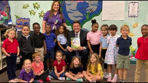 WPTV anchor Mike Trim reads to students at Village Green Environmental Studies School