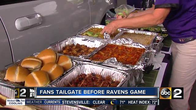 Baltimore Ravens fans tailgate before the season home opener