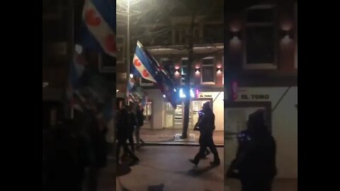 Farmers tractors leading the Dutch on torchlit protest against mandates.