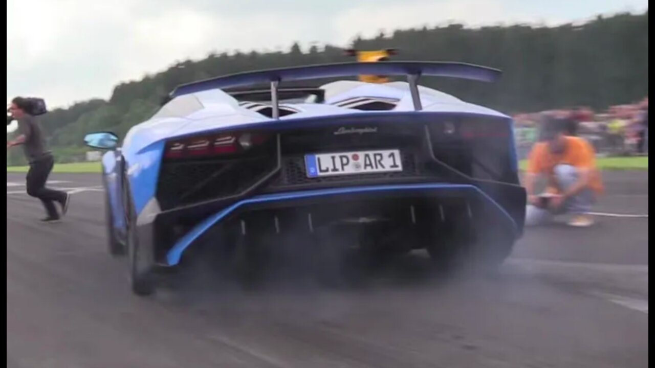 <<<Racing car passing very close to cameraman *UNBELIEVABLE" >>>