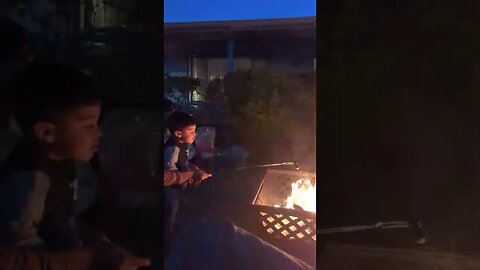 my sister's family enjoying time around the fire for Thanksgiving.