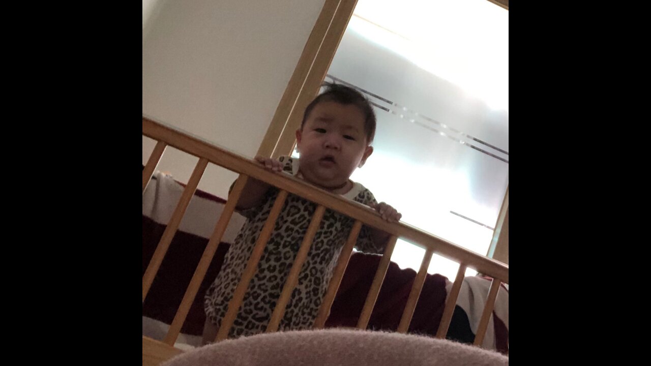 A baby crying right after his mother's voice.