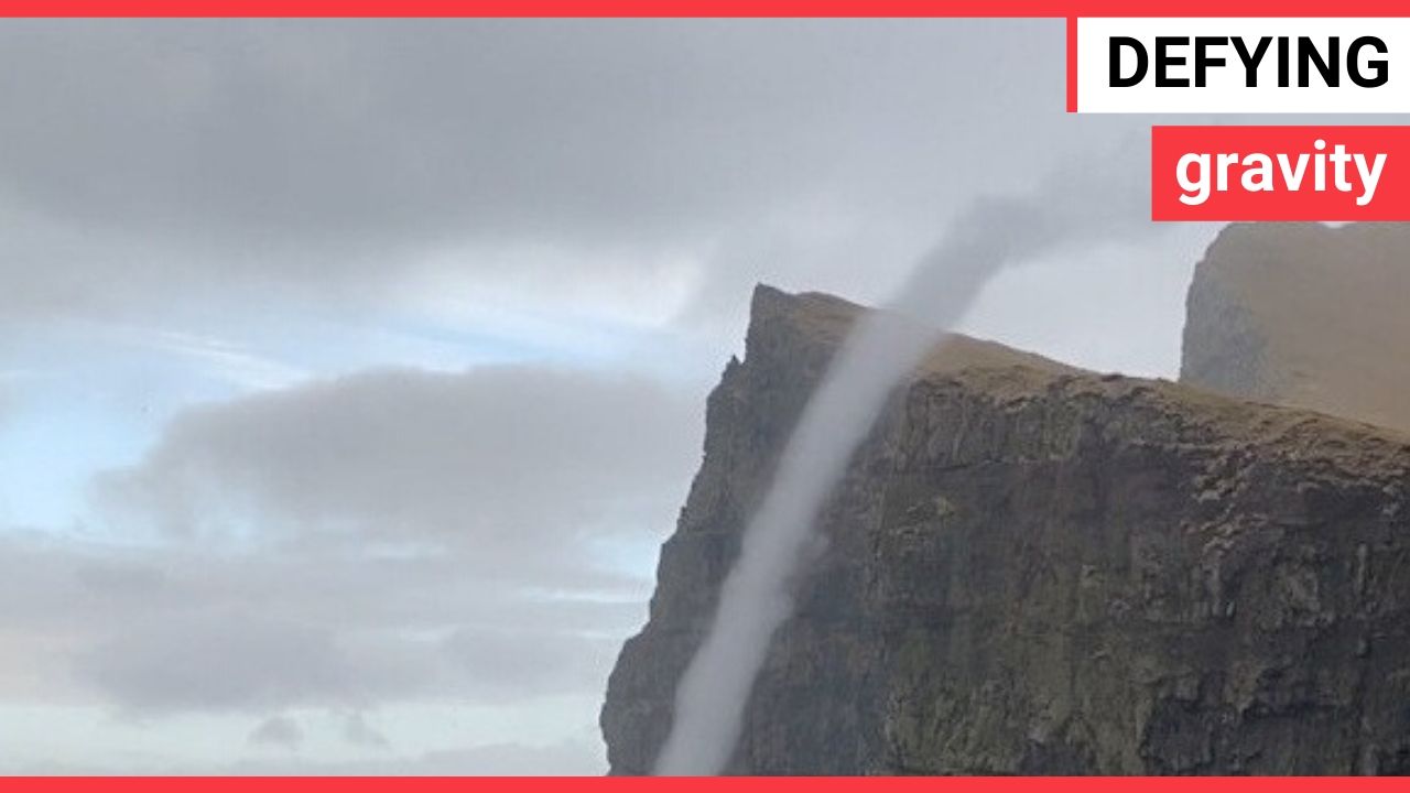 Incredible moment water flows UPWARDS in a rare sea vortex