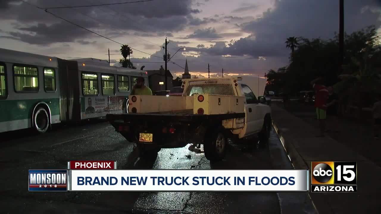 Driver gets brand new truck stuck in Phoenix flood waters