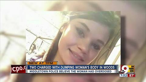 Two charged with dumping woman's body in woods