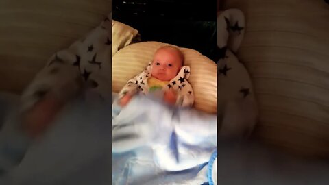 Cute Baby Boy Playing On The Bed