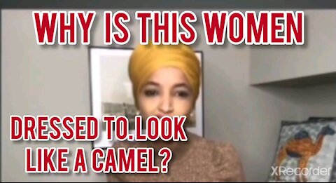 Why is this women DRESSED TO LOOK LIKE A CAMEL?