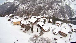 Paragliding through the snowy Swiss mountains