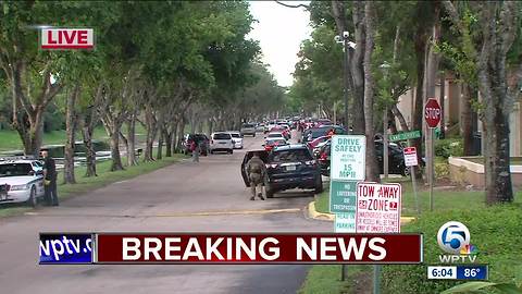 People return to homes after shooting in suburban West Palm Beach