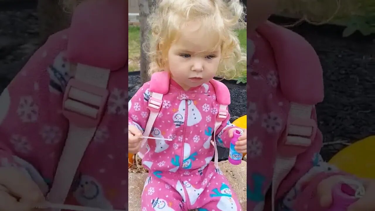 Funny Toddler Blowing Bubbles