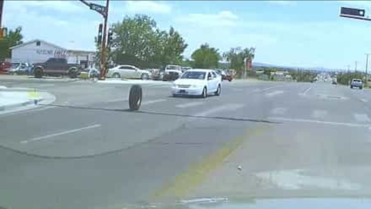 Driver let down as new tire spins free and hits oncoming car