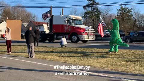 Prehistoric Patriot conducting an orchestra of truck horns