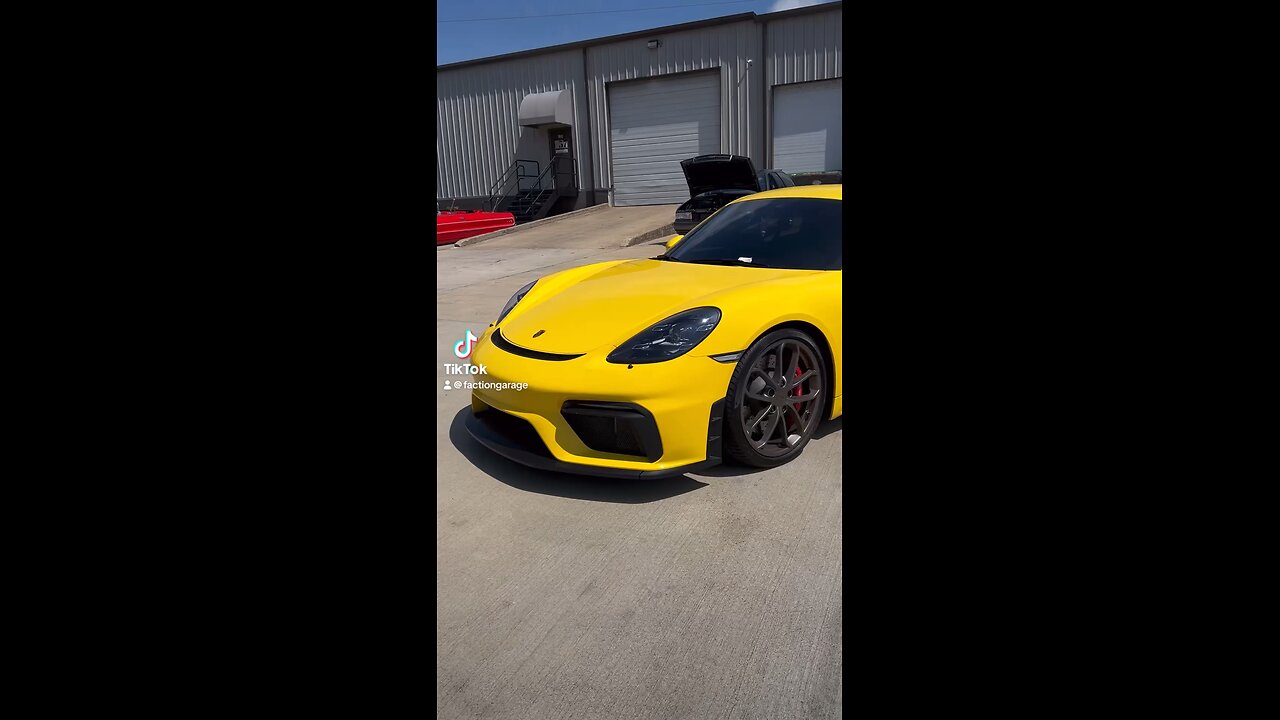 Yellow Porsche GT4