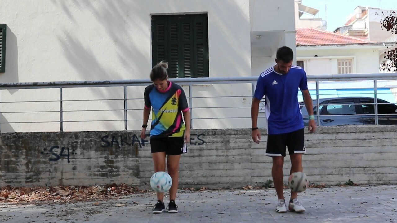 Duo Performs Different Balancing Tricks in Juggling Football