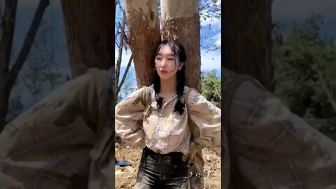 Hot Chinese Girl Carries Heavy Logs On Her Back