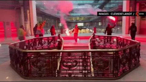 Protesters with flares enter Black Rock in Paris