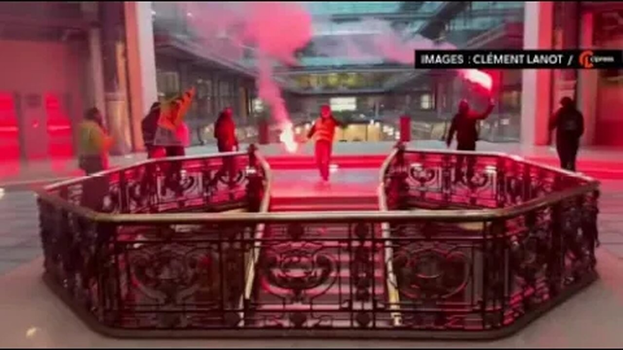Protesters with flares enter Black Rock in Paris