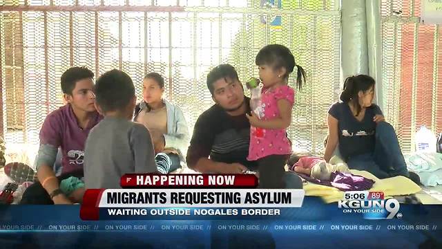 Central American migrants seeking asylum; waiting outside Nogales port