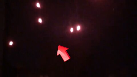 Witnessed a large number of UFOs glowing red in the city at night [Space]