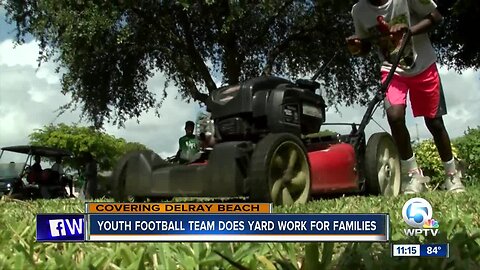 Youth football team does yard work for families